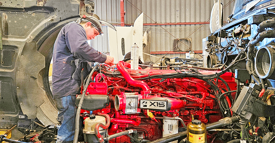 Mechanic Inspecting Semi-Truck